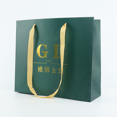 210gsmはショッピングのための印刷された贅沢な紙袋の光沢のあるラミネーションに塗った