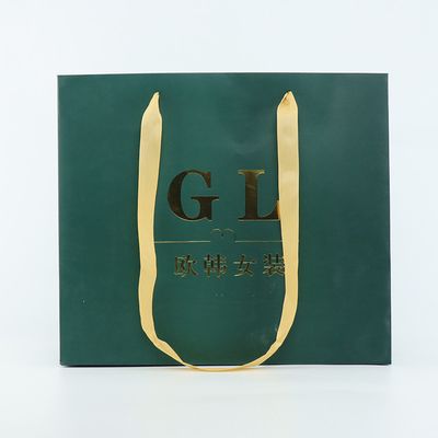 210gsmはショッピングのための印刷された贅沢な紙袋の光沢のあるラミネーションに塗った