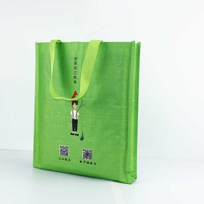 編まれる再使用可能なポリプロピレンは29*35cm通気性の扱われた袋の緑を袋に入れる