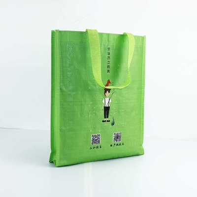 編まれる再使用可能なポリプロピレンは29*35cm通気性の扱われた袋の緑を袋に入れる